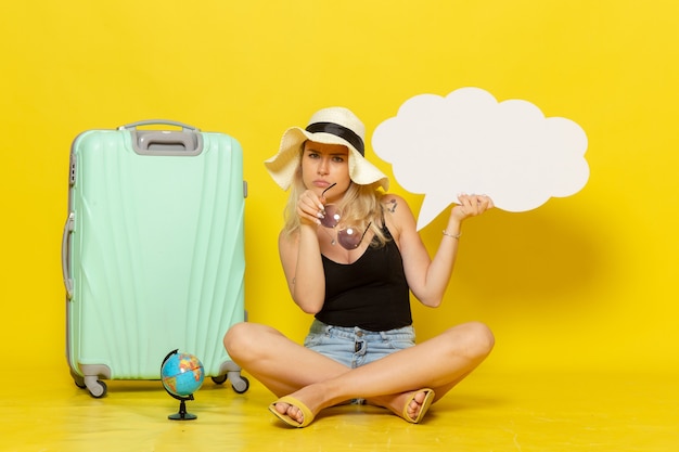 Free photo front view young female holding huge speech bubble