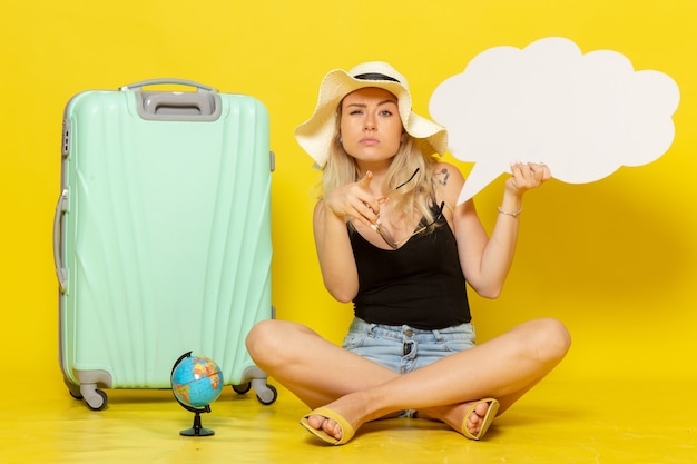 Free photo front view young female holding huge speech bubble