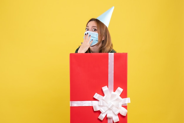 Free Photo front view young female inside present in sterile mask