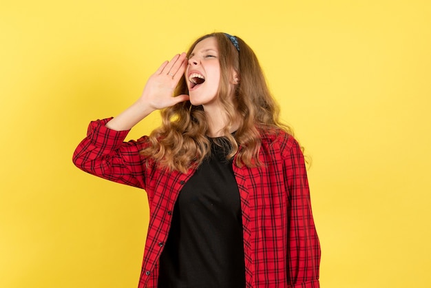 Free Photo front view young female in red checkered shirt posing and screaming on yellow background girls emotions color human model woman