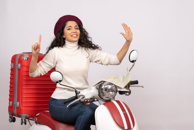 Front view young female sitting on bike on a white background color road motorcycle vehicle vacation woman city