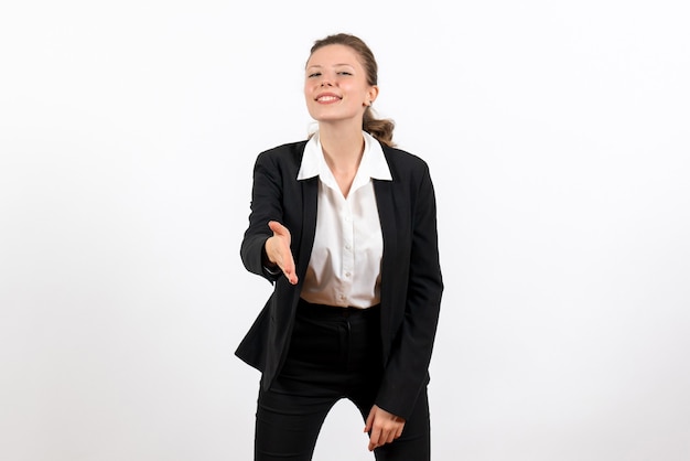 Free Photo front view young female in strict classic suit greeting someone on the white background business woman work female job suit