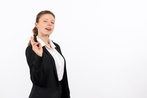 Front view young female in strict classic suit posing on a white background job business work costume woman