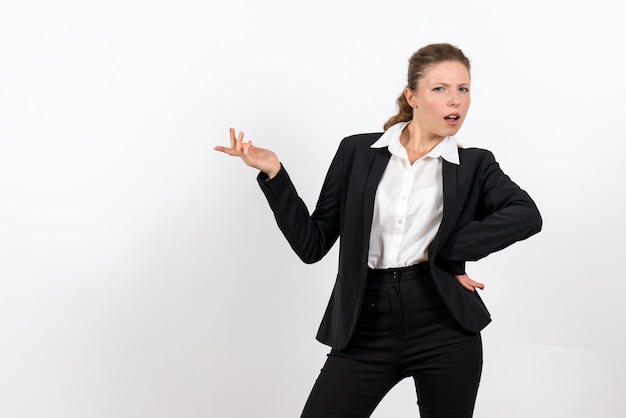 Free Photo front view young female in strict classic suit posing on a white background woman job business work costume female