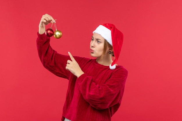 Front view young female with christmas toys, holiday christmas emotion