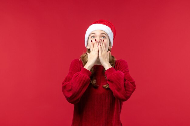 Front view young female with excited expression, christmas holiday red