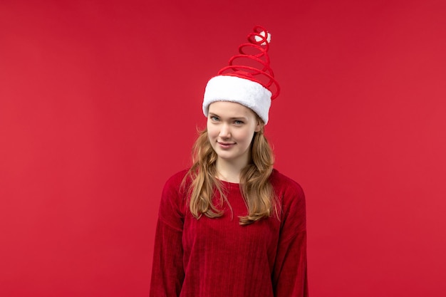 Free Photo front view young female with skeptical expression, red christmas holiday