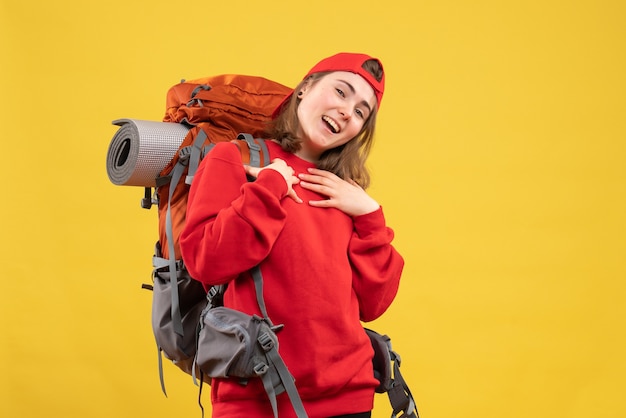 Front view young happy tourist with backpack