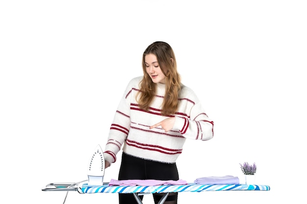 Free photo front view young housewife with ironing board and iron on white