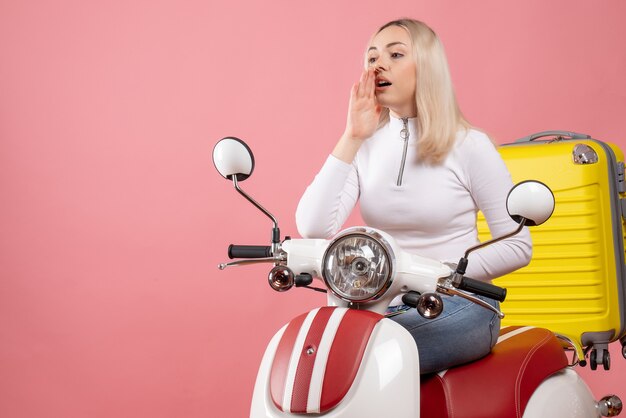 Front view young lady on moped calling someone