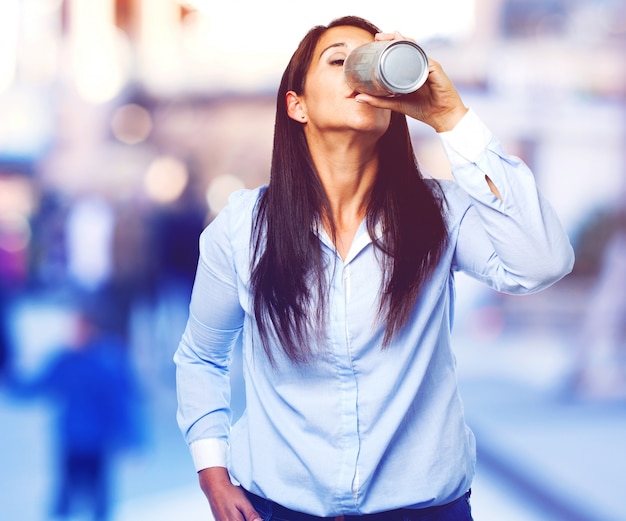 Free photo front view of young lady with a can