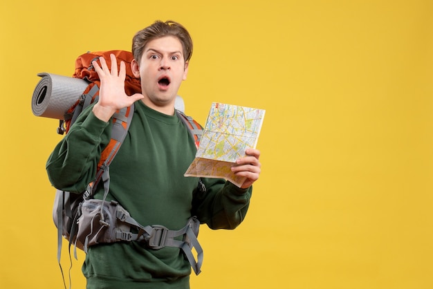 Free Photo front view young male preparing for hiking holding map