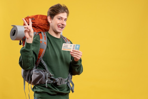 Front view young male preparing for hiking holding ticket