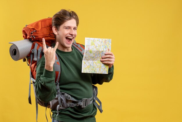 Front view young male with backpack holding map