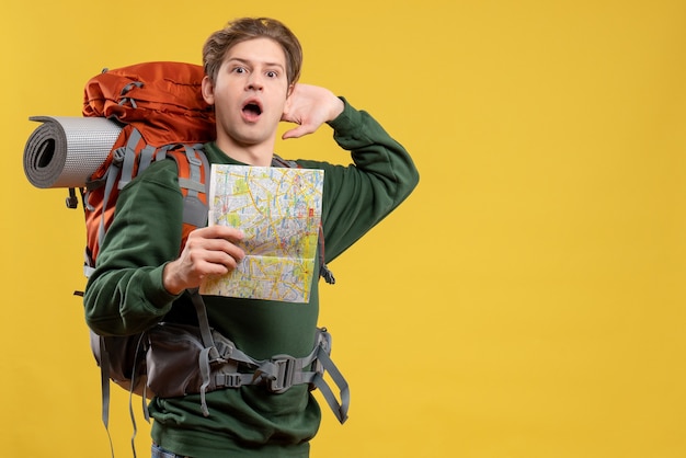 Front view young male with backpack holding map