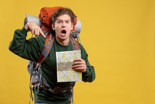 Free photo front view young male with backpack holding map