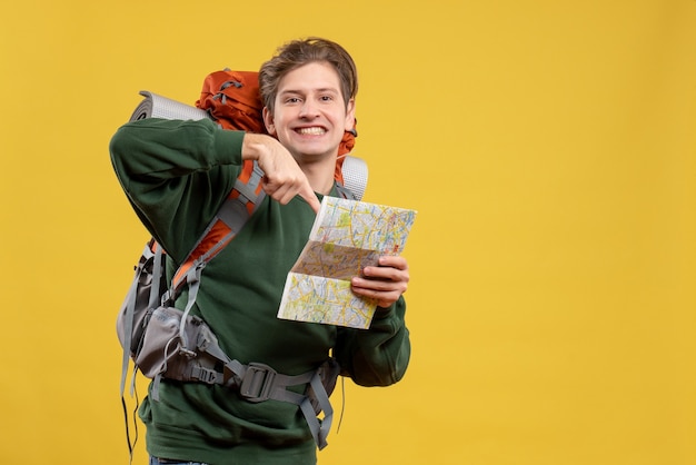 Front view young male with backpack holding map