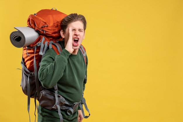 Free photo front view young male with backpack preparing for hiking and calling