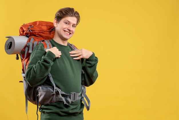 Front view young male with backpack preparing for hiking