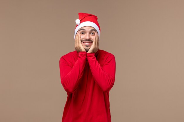 Front view young male with excited face on brown background emotion holiday male