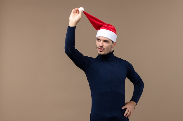 Free Photo front view young male with red christmas cap, holiday christmas eve