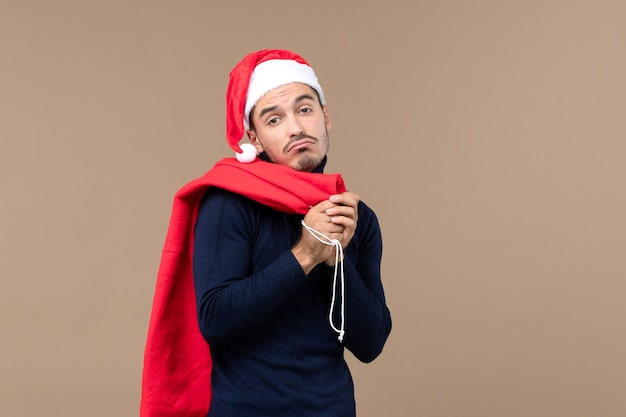 Front view young male with sad expression, christmas holiday santa