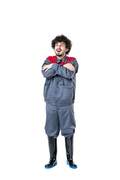 front view young male worker in uniform feeling excited on white background