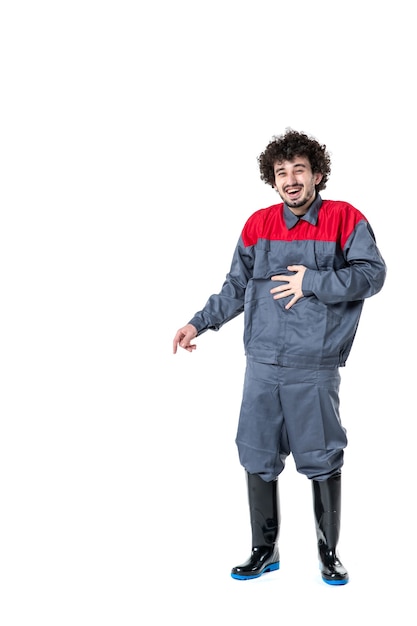 Free photo front view young male worker in uniform laughing on a white background