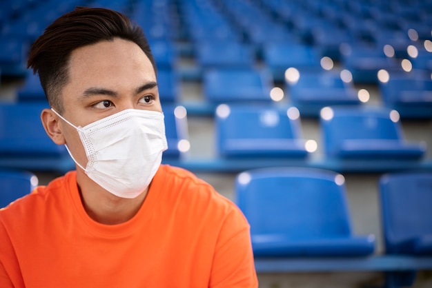 Front view young man wearing mask