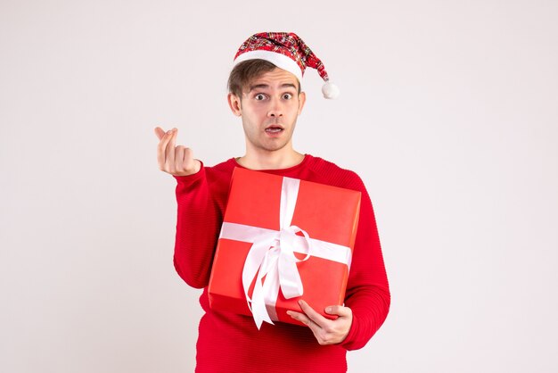 Front view young man with santa hat standing on white background