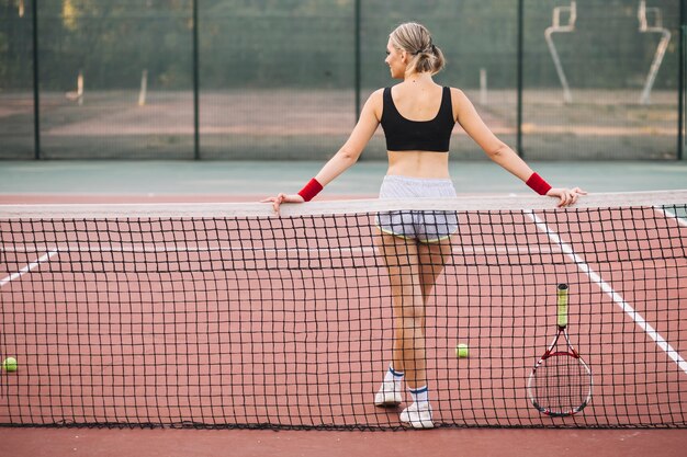 Front view young tennis player on break