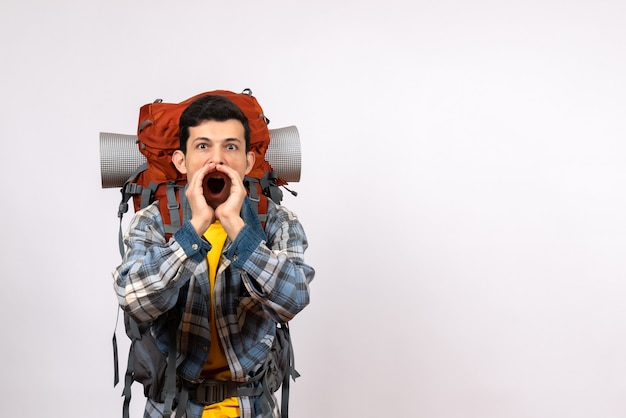 Front view young traveller with backpack screaming