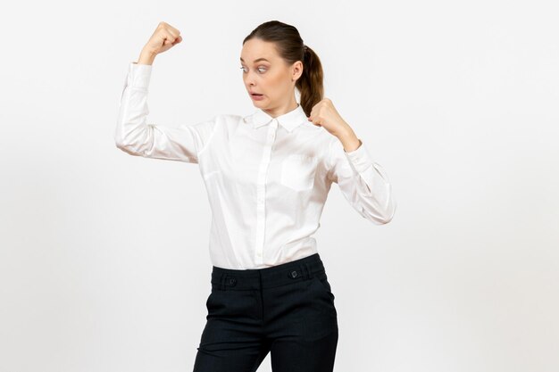 Front view young woman in elegant white blouse with rejoicing face on a white background woman office job lady female worker