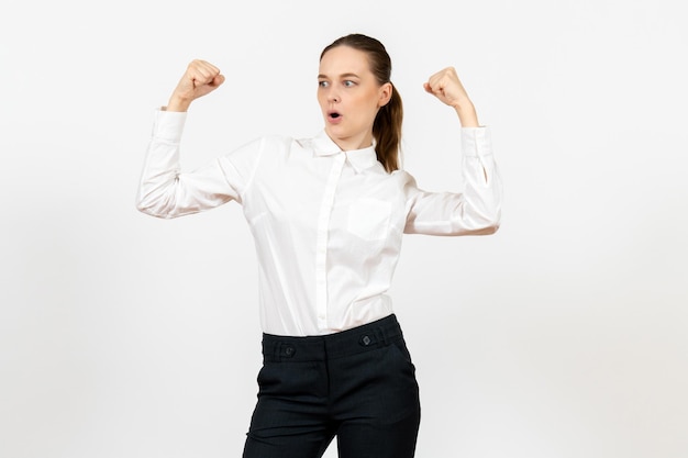 Front view young woman in elegant white blouse with rejoicing face on white background woman office job lady female worker