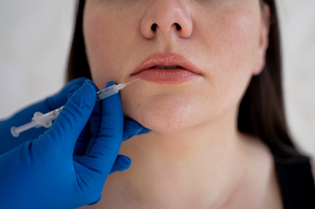 Front view young woman getting injection