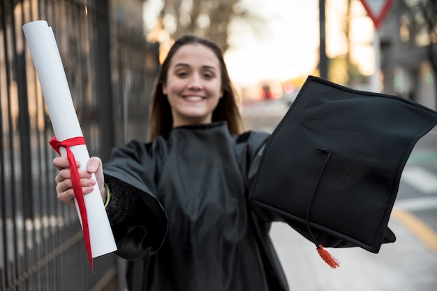 Free photo front view young woman graduating