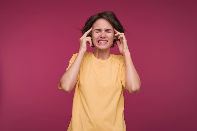 Free photo front view of a young woman having a headache