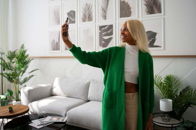 Free photo front view young woman spending time at home