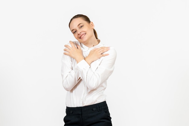 Front view young woman in white blouse with delighted expression on white background female feeling model office emotion job