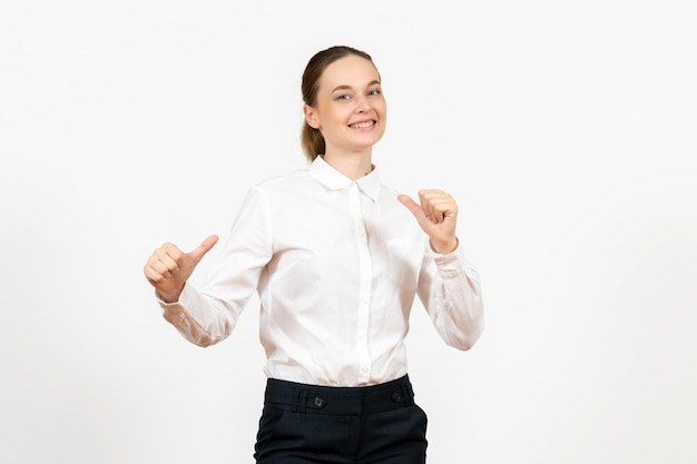 Front view young woman in white blouse with excited expression on light white background office job female emotion feeling model