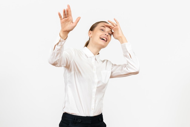 Front view young woman in white blouse with excited expression on a white background female model office emotion job feeling