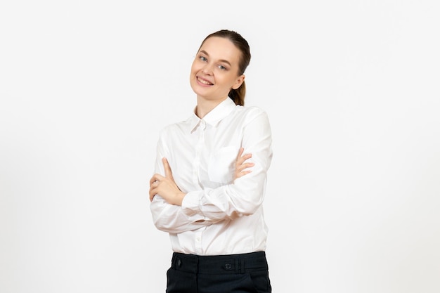 Front view young woman in white blouse with smiling face on white background job female feeling model emotions office