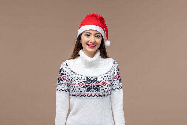 Front view young woman with christmas cape on brown background holiday emotion christmas