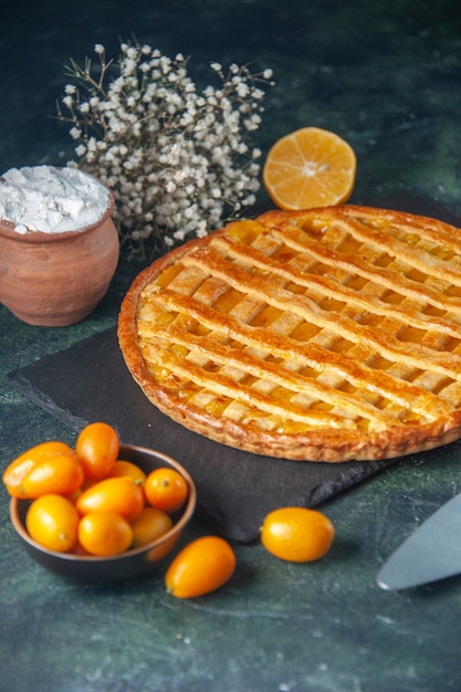 Free photo front view yummy kumquats pie on dark-blue background