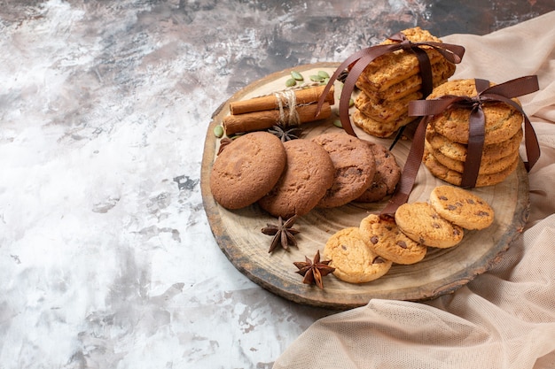 Front view yummy sweet biscuits on light background color cocoa sugar tea cake pie cookie sweet