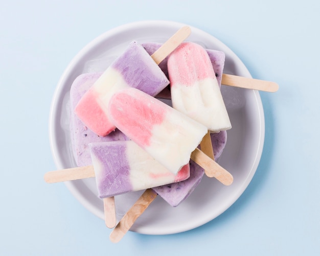 Fruit ice cream flavor on plate on table