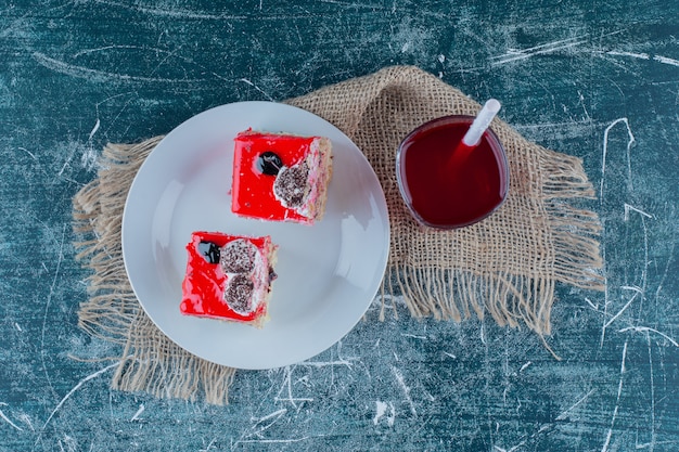 Fruit juice and a bowl of cake , on the background. High quality photo