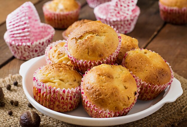 Fruit muffins with nutmeg and allspice on a wooden table