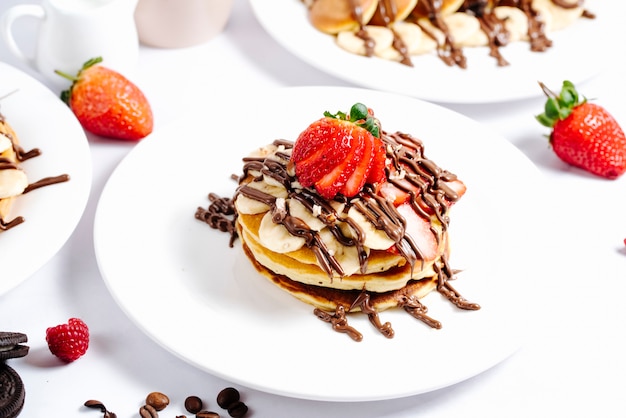 Fruit pancake topped with hot chocolate