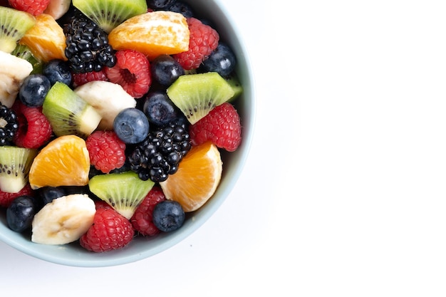 Free photo fruit salad in a blue bowl isolated on white backgroundxa